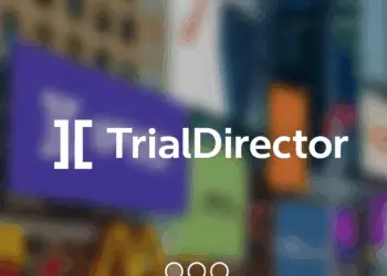 Logo of TrialDirector displayed on a digital screen over a blurred background of colourful lights.