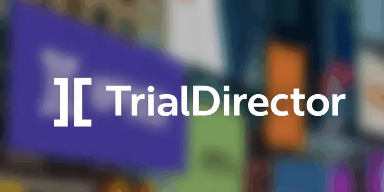 Logo of TrialDirector displayed on a digital screen over a blurred background of colourful lights.
