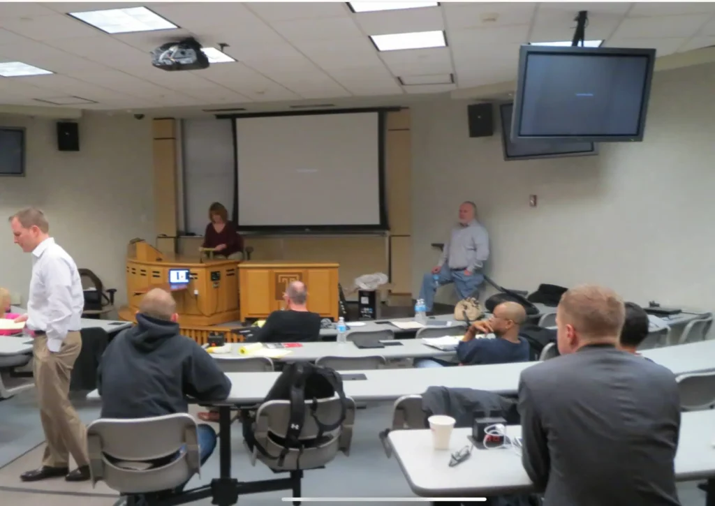 Temple LL.M. in Trial Advocacy workshop during a dress-down Saturday session, with students participating in hands-on trial technology training in the classroom.