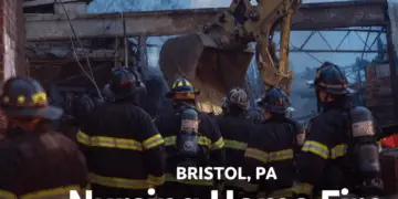 Firefighters and an excavator working at the scene of the Bristol, PA nursing home fire after the December 2025 explosion.