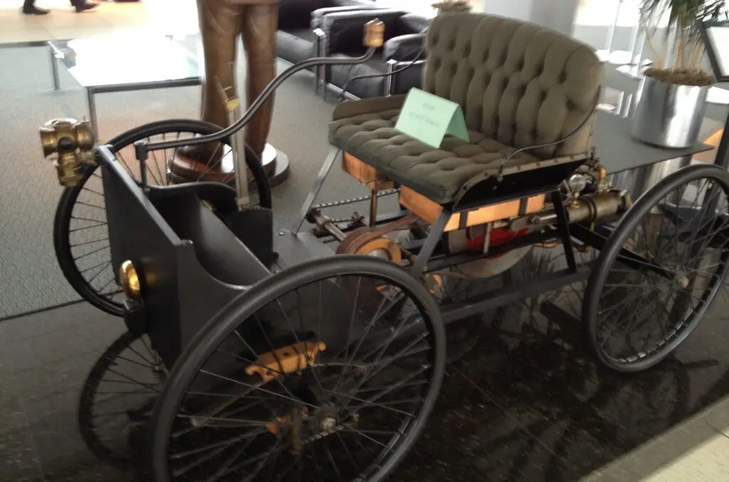 Ford Quadricycle exhibit displaying Henry Ford's first experimental automobile, a four-wheeled gasoline-powered vehicle built in 1896.